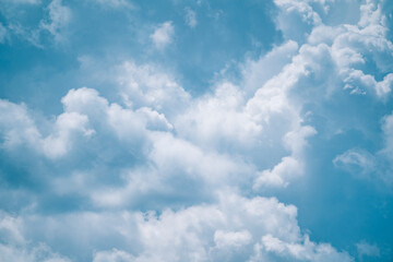 Abstract background of clouds sky with white voluminous foamy air magic clouds in a blue sky. Calm, relax, paradise, heaven, inspiration.
