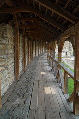 Fototapeta na wymiar Steep wooden galleries of the old fortress