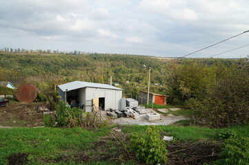 A tree-like autumn panorama of one of the villages in the foothills of the Carpathian Mountains.