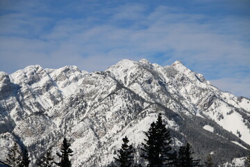 Mountain Range. Snow covered Rocky mountains on the bright sunny day.
