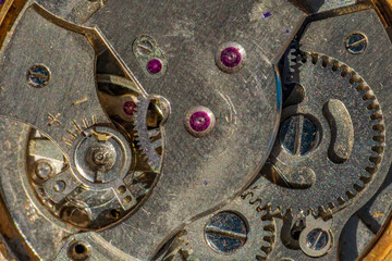 Vintage watch machine macro detail. Close up of old clock.