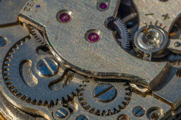 Vintage watch machine macro detail. Close up of old clock.