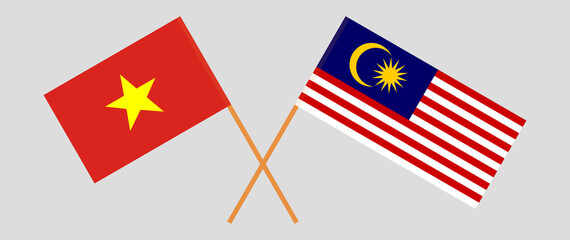 Crossed flags of Vietnam and Malaysia. Official colors. Correct proportion