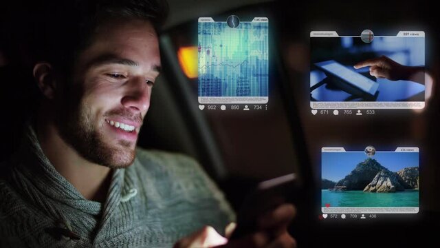 Young handsome caucasian man using a smartphone in a car at night to check his social media account. Futuristic technology concept. Photo and Video sharing app. Holographic interface. AR.