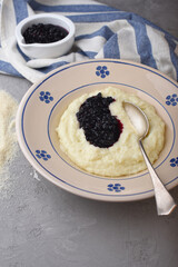 Semolina mash with elderberry compote