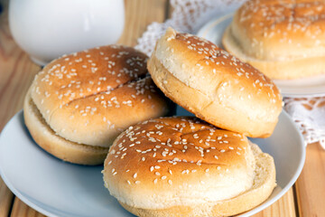 Fresh burger buns with sesame. Selective focus.
