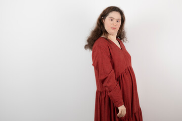 Image of a young cute girl with down syndrome standing and posing