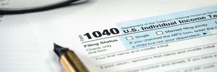 Tax form USA business income office concept. Tax Return Form 1040. Wide banner