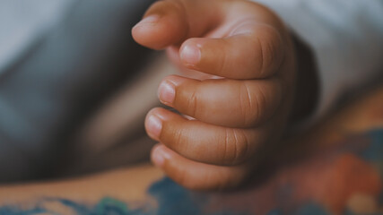 Close up hand of african american black baby. High quality photo