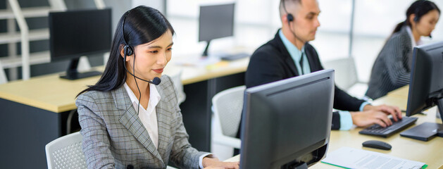 Asian Women Public Relations Unit Holding the call center headset, the call center is talking to...