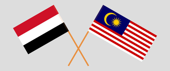 Crossed flags of Yemen and Malaysia. Official colors. Correct proportion