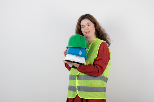 Image of a young cute girl with down syndrome standing in vest 