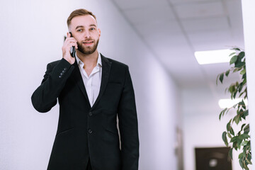 Successful business man have telephone conversation while standi