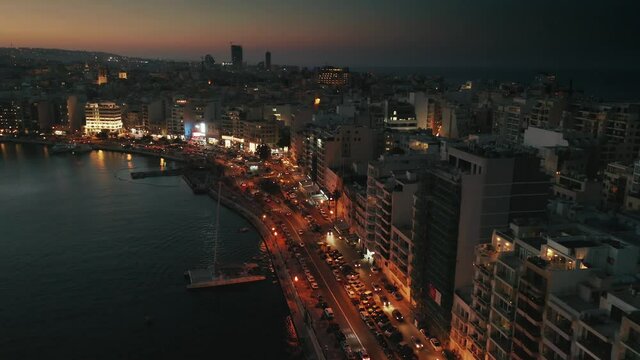 Sliema coast road on night time. Aerial view. Maltese famous city