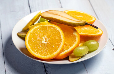 Fruit salad served in a white bowl