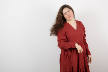 Image of a young cute girl with down syndrome standing and posing