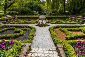 Small square in park with plants in card symbols shape