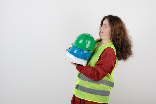 Image of a young cute girl with down syndrome standing in vest