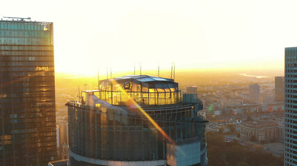 Warsaw, Poland 01.11.2020 Golden sunrise over the Warsaw office tower Spektrum tower and club The...