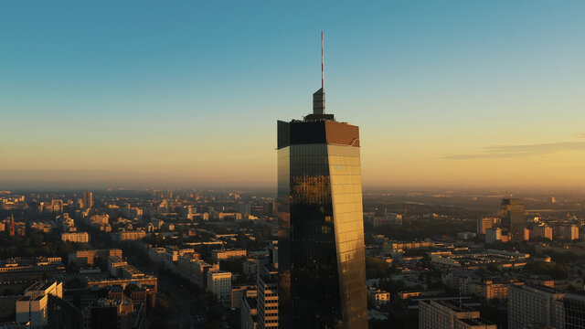 Warsaw, Poland 01.12.2020. Aerial view of skyscraper of business district in city centre with Deloitte logo on the top. High quality photo
