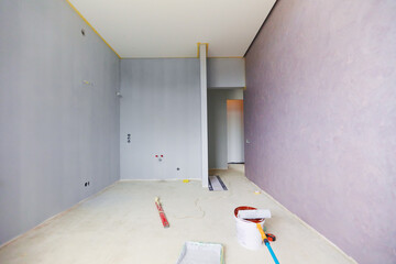 a new apartment repair finishing works in progress, plastering, painting and flooring constraction