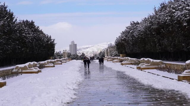 Ankara, Turkey - February 16 2021: People visit Anitkabir in winter time. People walk on lion road.