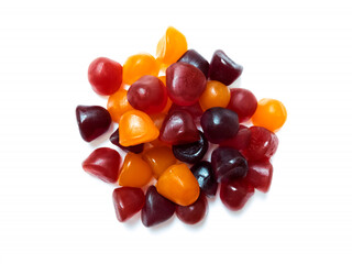 Close-up texture of red, orange and purple multivitamin gummies. Healthy lifestyle concept.