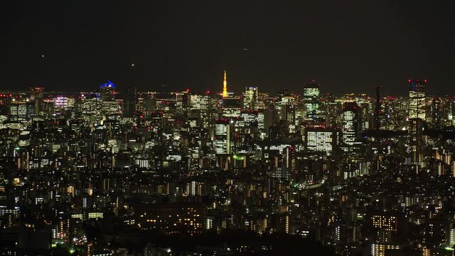 TOKYO, JAPAN : Aerial high angle sunrise CITYSCAPE of TOKYO. View of office buildings around crowded downtown area. Japanese business and urban metropolis concept. Time lapse video, night to morning.