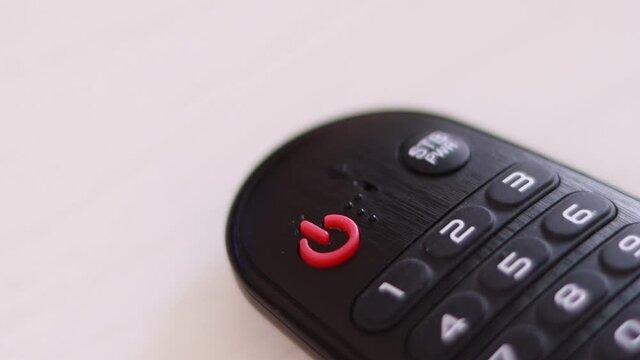 Blinking power button on the remote control.