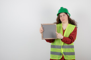 Image of a young cute girl with down syndrome standing in vest