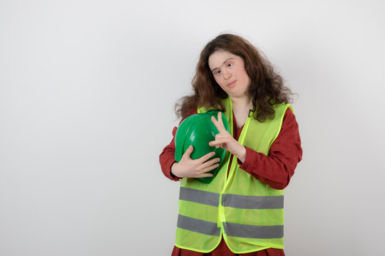 Image of a young cute girl with down syndrome standing in vest