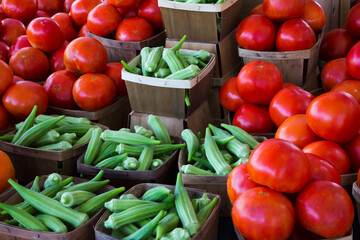USA, Georgia, Savannah. Tomatoes and okra at vegetable stand.