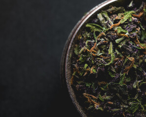 Fototapeta na wymiar Purple Haze Cannabis Marijuana inside a grinder