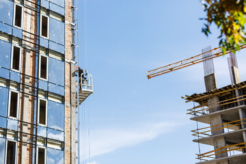 Construction site with concrete and steel and crane lifting equipment