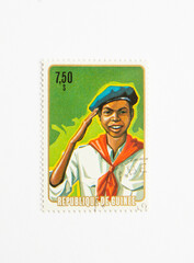 Guinea Republic Postage Stamp. circa 1974. Scout Boy salute.