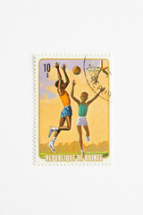 Guinea Republic Postage Stamp. circa 1974. boy scouts playing basketball