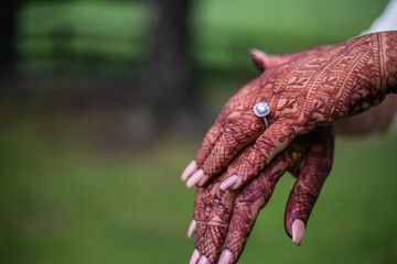 Indian bride's henna mehendi mend hands close up