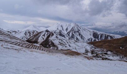 Fototapeta na wymiar Erzurum Palandoken mountains summit ejder 3200. Ski resort in Turkey in cloudy day. January 2021