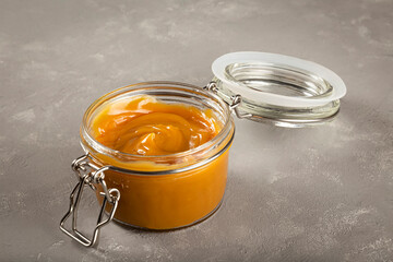 Close-up of jar full of dulce de leche. Dulce de leche, traditional sweet in Latin America.