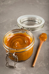 Close-up of jar full of dulce de leche. Dulce de leche, traditional sweet in Latin America.