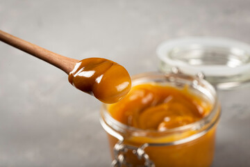 Close-up of jar full of dulce de leche. Dulce de leche, traditional sweet in Latin America.