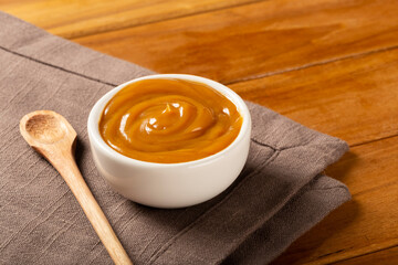 Close-up of jar full of dulce de leche. Dulce de leche, traditional sweet in Latin America.