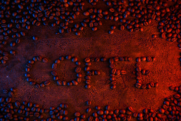 background for design in the center of the image with coffee beans lined with the word coffee. coffee beans in blue red rays of light