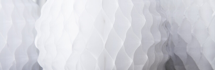 Banner of honeycomb tissue paper pattern; Background of white and grey honeycomb paper