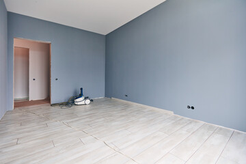 a new apartment repair finishing works in progress, plastering, painting and flooring construction