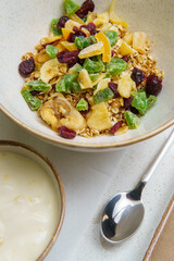 Plates with muesli and yogurt on the table. Oatmeal with fruit and yogurt. Healthy eating. Light and tasty breakfast. Diet