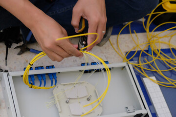 Technicians are cutting and fusion fiber optic cables.