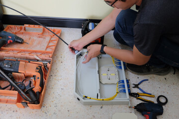 Technicians are cutting and fusion fiber optic cables.
