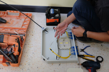Technicians are cutting and fusion fiber optic cables.