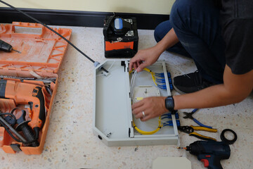 Technicians are cutting and fusion fiber optic cables.